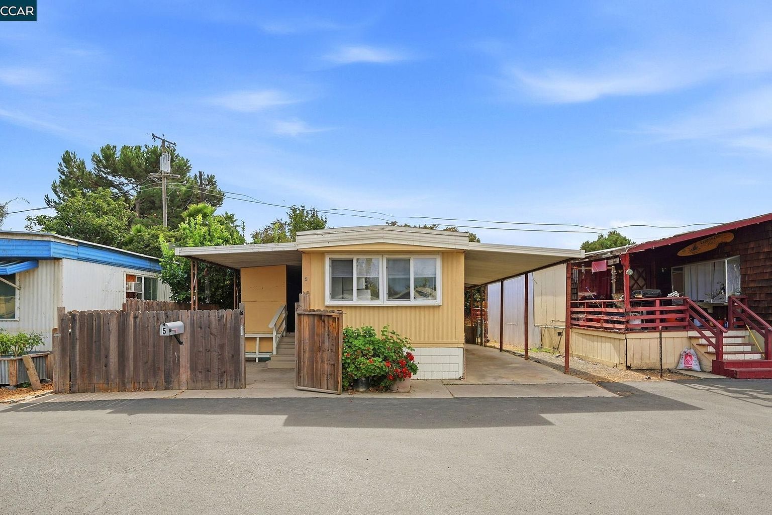 Exterior of 841 W Brannan Island Rd Spc 5 in Isleton, California, with fenced yard and carport